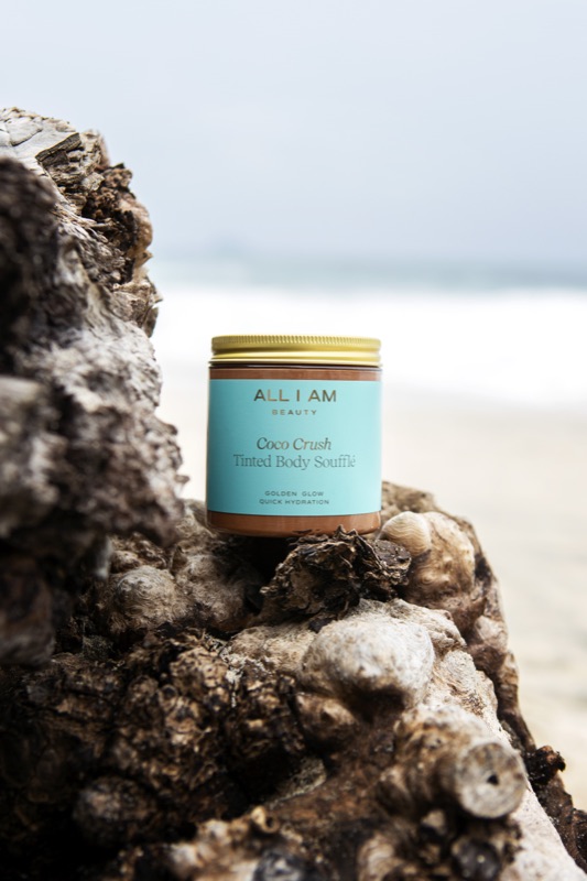 All I Am Beauty, Coco Crush body souffle, on driftwood by the sea