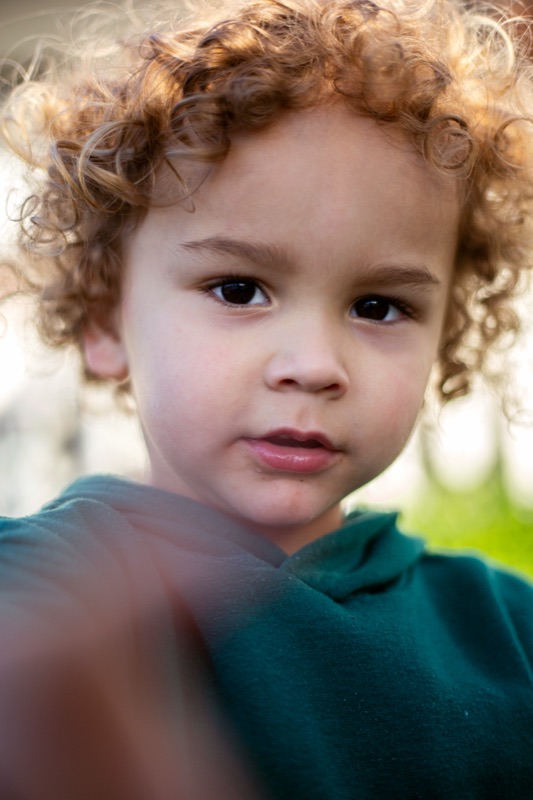 Close portrait of a curly-haired child